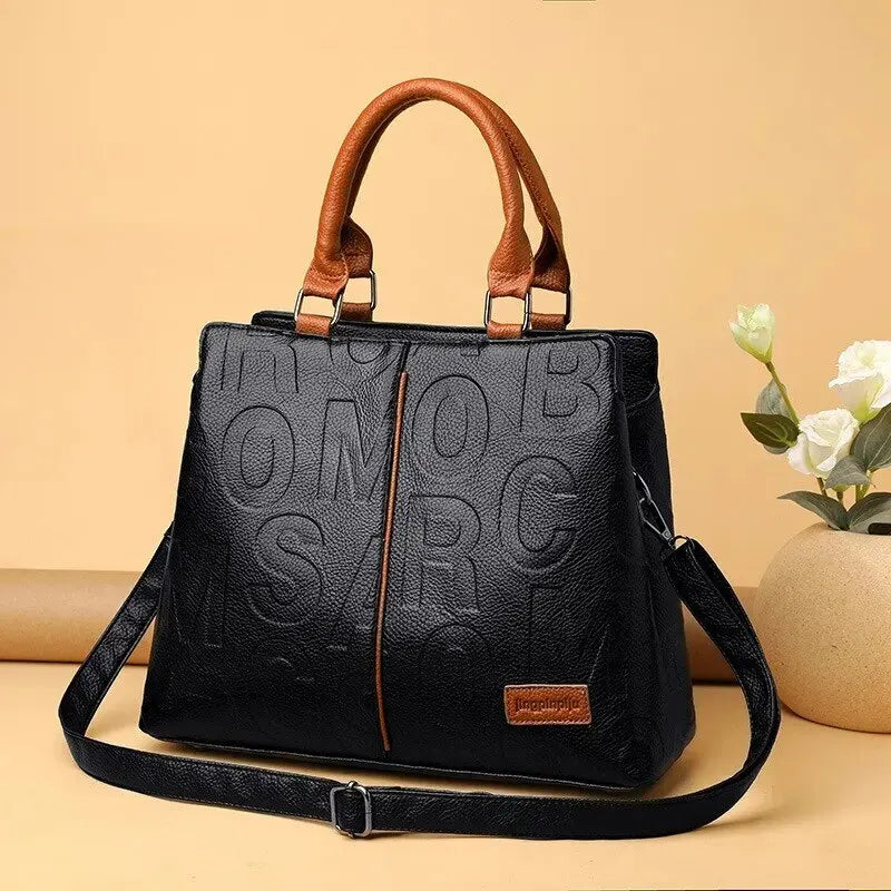 2023-New-Fashion-Solid-Color-Shoulder-Large-Capacity-Soft-Leather-Cloth-Letter-Embossed-Ladies-Handbag_38e6e897-95b6-4036-af78-3edd43710ae6.webp
