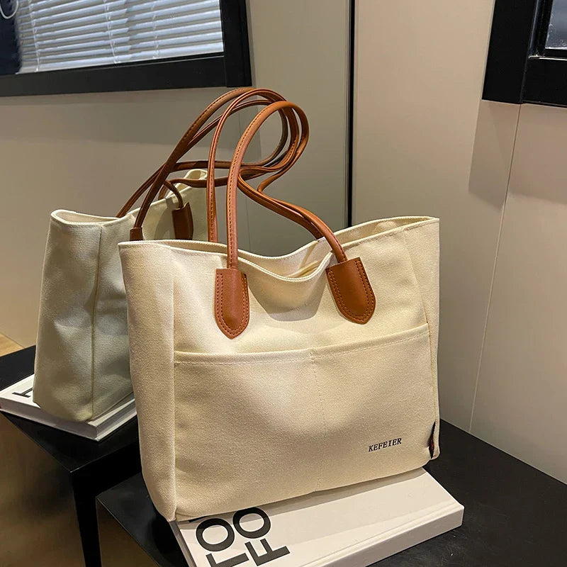 Large-Capacity-Women-s-Canvas-Bag-2023-New-Luxury-Design-Handbag-PU-Leather-Strap-Shoulder-Shopping_6aafd84b-4dad-47ec-bb33-4f0e13ac25a5.webp