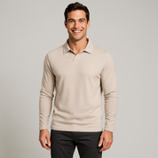 Man wearing a beige long-sleeve polo shirt against a gray background