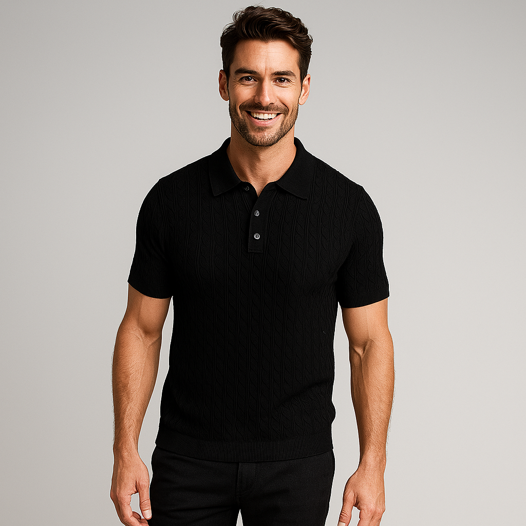 Man wearing a black polo shirt against a gray background