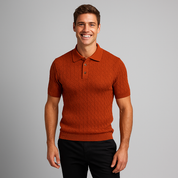 Man wearing a rust-colored knitted polo shirt against a gray background