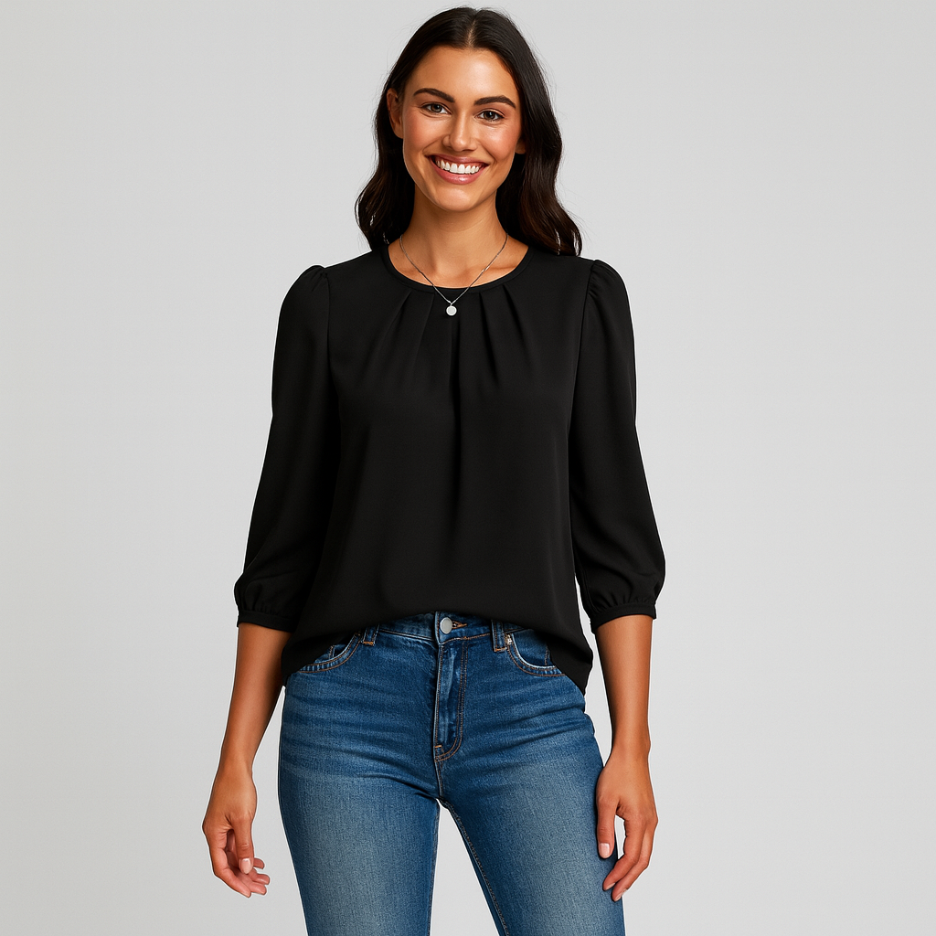 Woman wearing a black blouse and blue jeans on a gray background